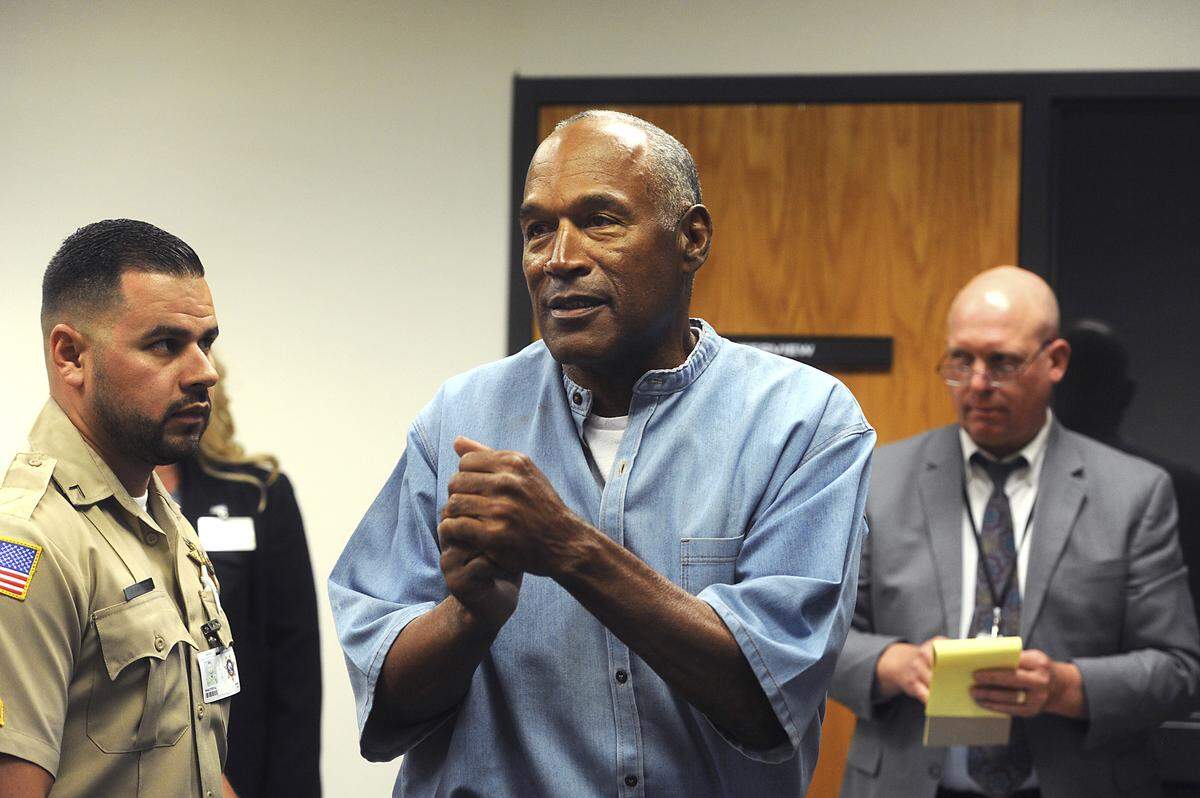 Former NFL football star O.J. Simpson reacts after learning he was granted parole from Lovelock (Nev.) Correctional Center on July 20, 2017. Simpson now lives in Las Vegas, quietly, until now, with his emergence on social media with a Twitter account. (Jason Bean/The Reno Gazette-Journal via AP, Pool)