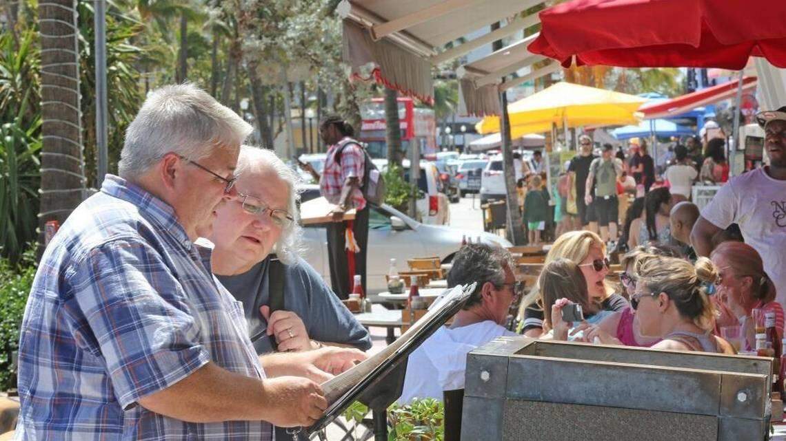 Tourists order lunch on busy Ocean Drive in Miami Beach on Sunday, September 24, 2017.