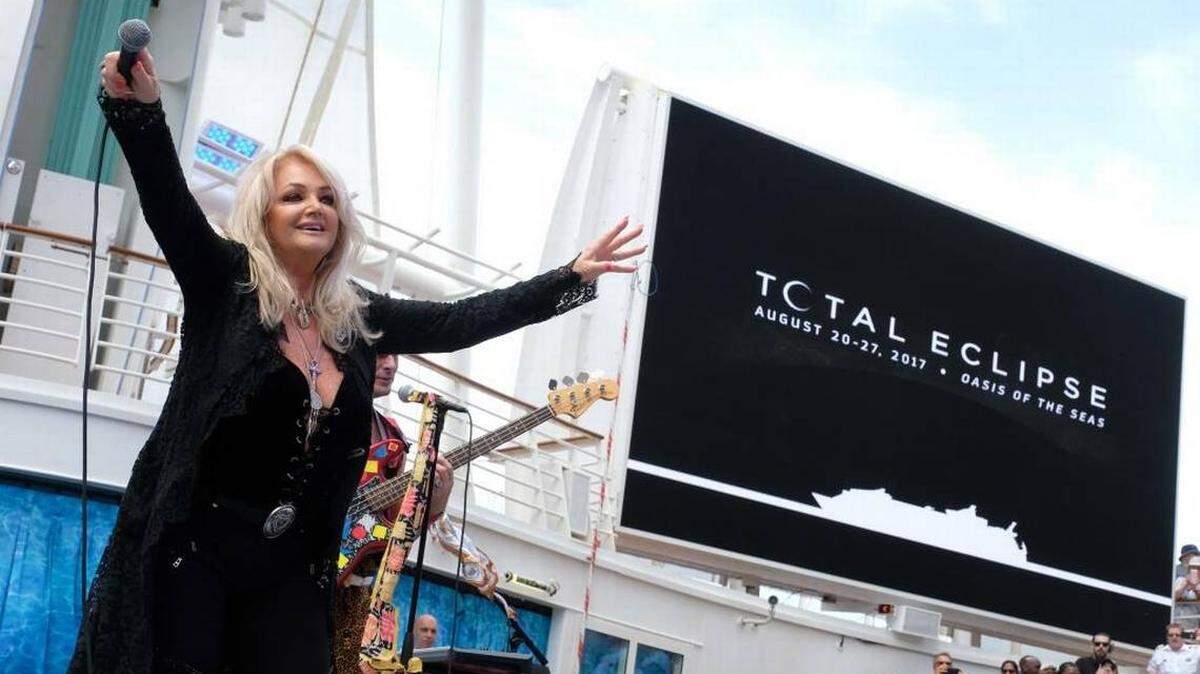 Bonnie Tyler performs “Total Eclipse of the Heart” with pop band DNCE aboard Royal Caribbean International’s Oasis of the Seas on Monday during the solar eclipse.