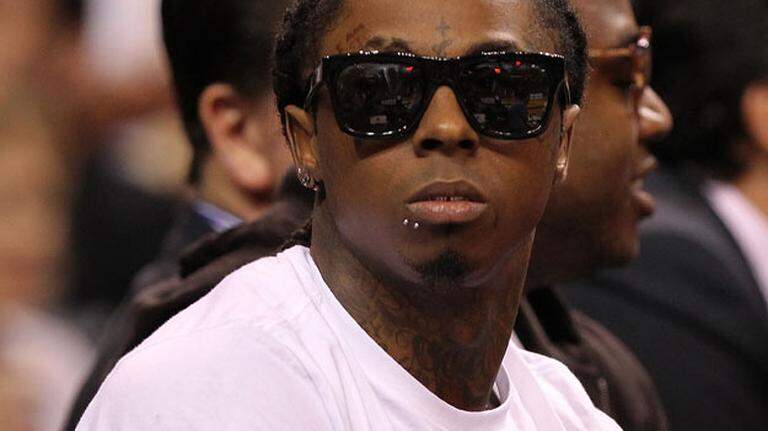 Lil Wayne admitted owning gold pistol on jet, records show. He said it was a Father’s Day gift.