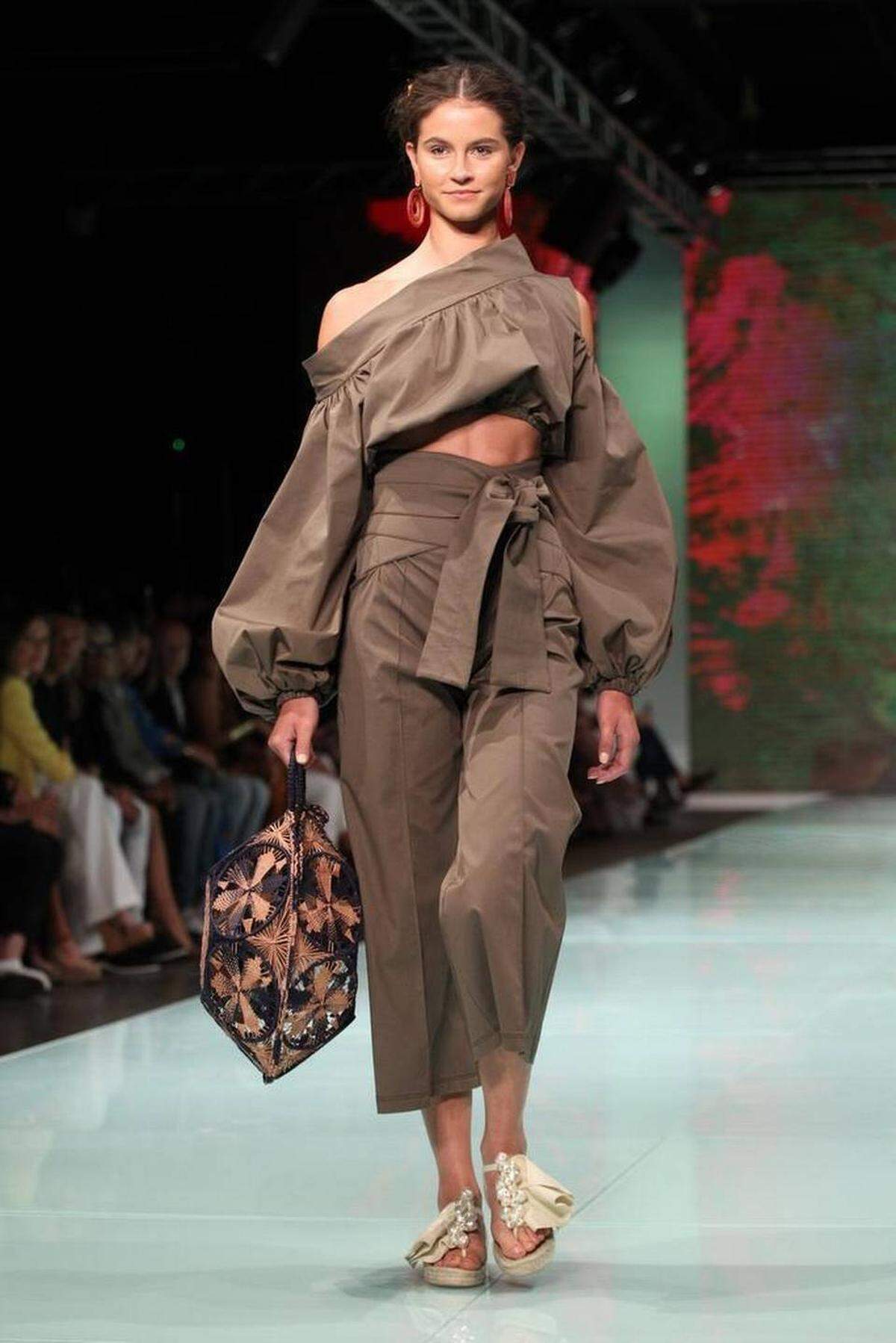 Fashion models work the runway wearing the fashion line by Miami designer Silvia Tcherassi inside the Ice Palace during Miami Fashion Week on Thursday, June 1, 2017.