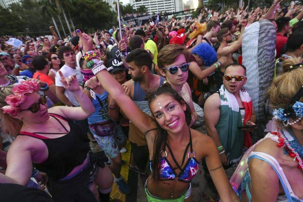 Guests dance during the second day of Ultra Music Festival in downtown Miami on Saturday, March 25, 2017.