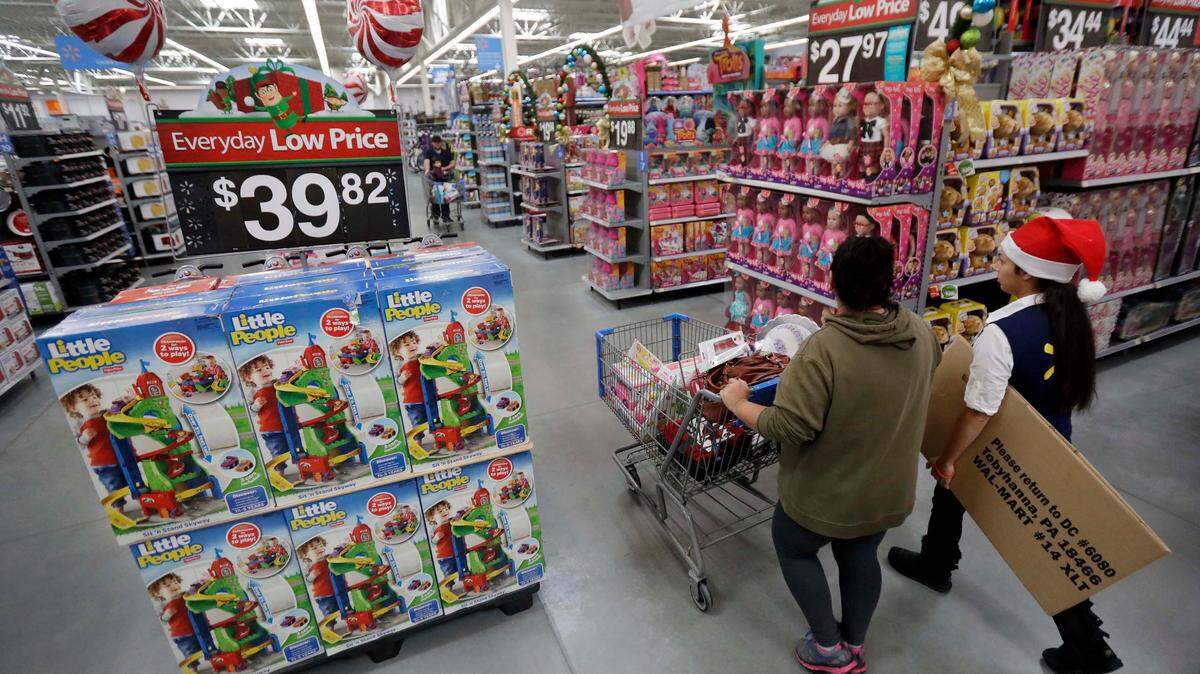 Big retailers like Walmart, seen here in a 2019 file photo, can still have separate aisles for boys and girls toys, but new California law requires a gender-neutral section with a mix of products.