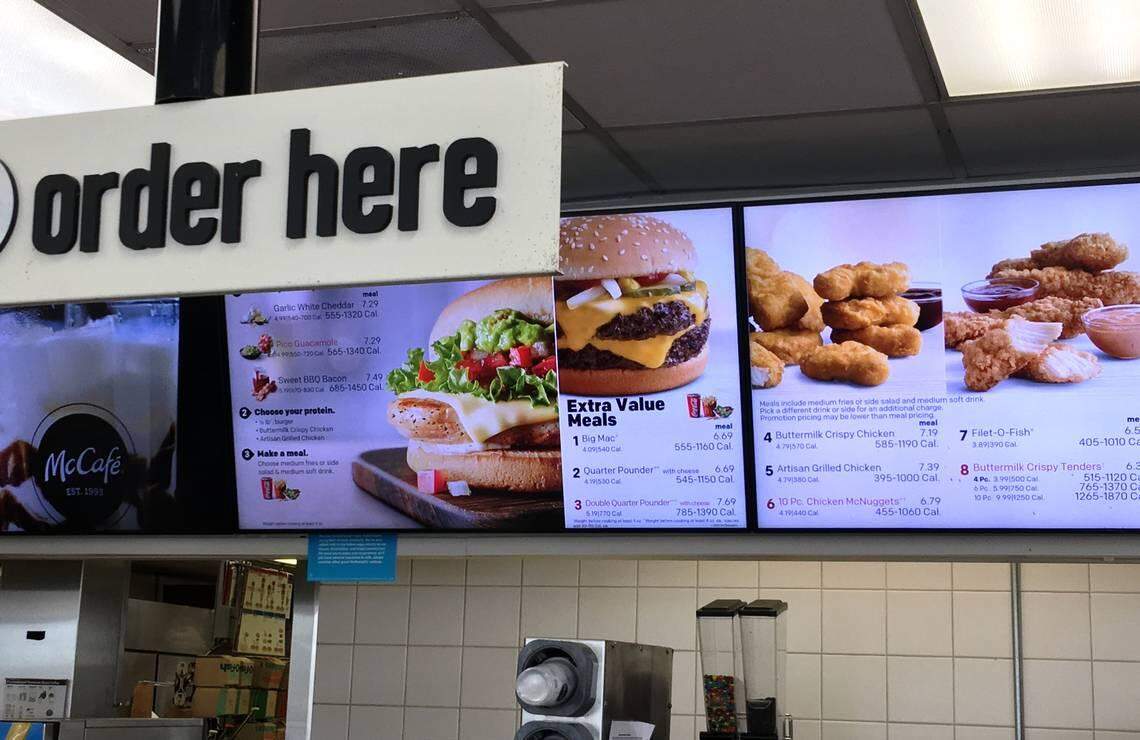 The McDonald’s menu board at a Doral location on Southwest 87th Avenue shows a Quarter Pounder with Cheese as one of the selections on May 22, 2018.