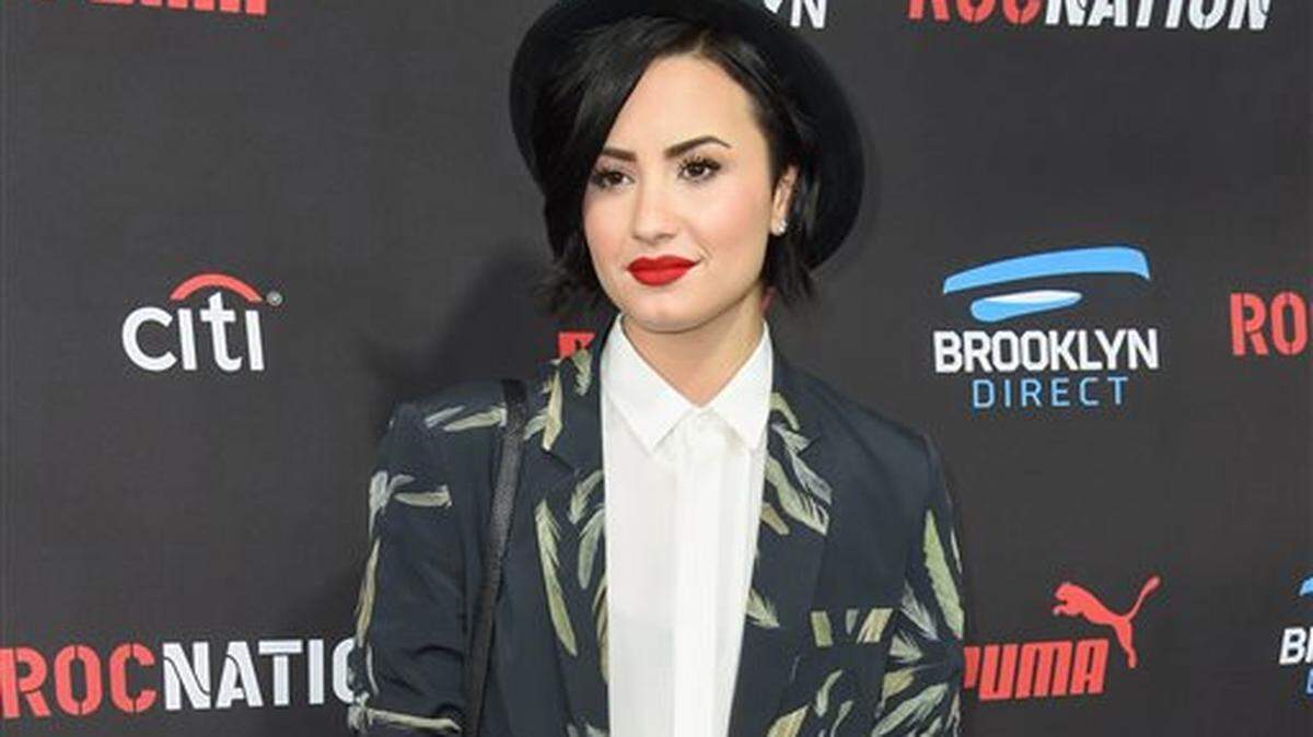 FILE - In this Feb. 7, 2015, file photo, Demi Lovato arrives at the Roc Nation Pre-Grammy Brunch at RocNation Offices in Beverly Hills, Calif. Lovato is sharing her personal story and encouraging others to do the same through Be Vocal: Speak Up For Mental Health, an initiative launched Thursday, May 28, 2015, by a pharmaceutical company, the National Alliance on Mental Illness and other mental-health advocacy groups. Its aim is to improve treatment options at all levels and erase the stigma around mental illnesses. (Photo by Rob Latour/Invision/AP, File)