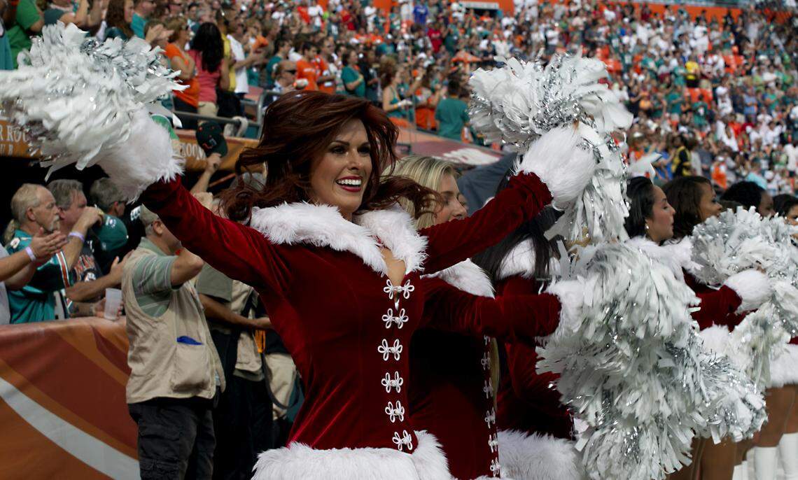 A Miami Dolphins cheerleader dances in Santa outfit before the game with the Miami Dolphins and the Philadelphia Eagles at Sun Life Stadium in Miami Gardens on December 11,2011.