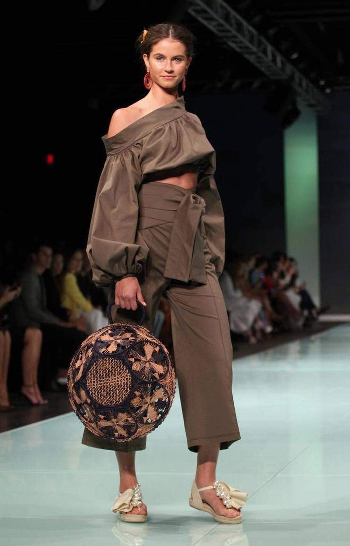 Fashion models work the runway wearing the fashion line by Miami designer Silvia Tcherassi inside the Ice Palace during Miami Fashion Week on Thursday, June 1, 2017.
