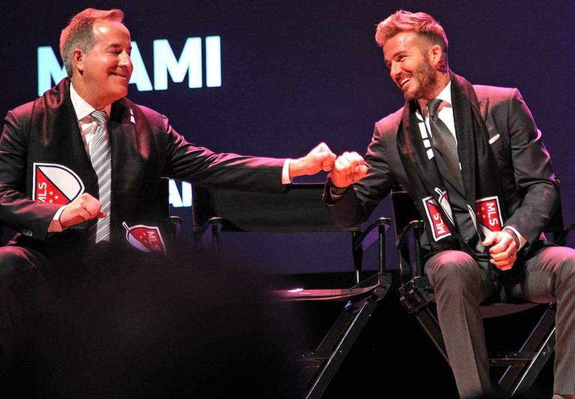 Partners of the Miami MSL team Jorge Mas and David Beckham, exchange a “fist bump” during the announcement of the new Miami MSL team.