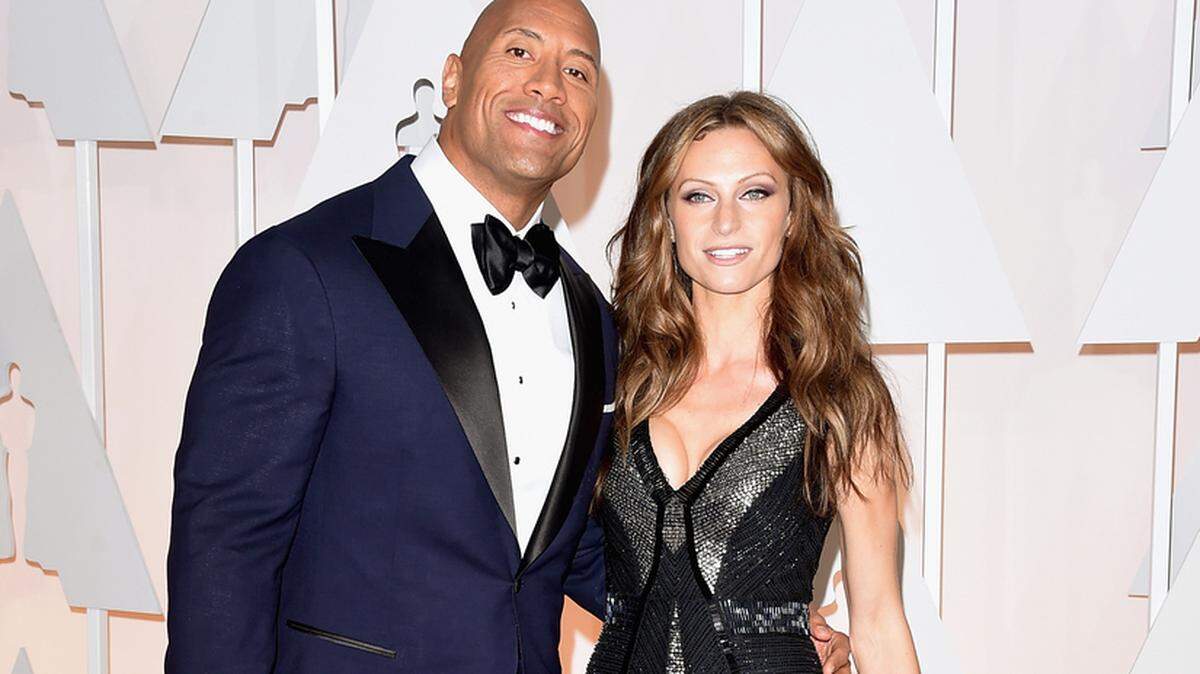 HOLLYWOOD, CA - FEBRUARY 22:  Actor Dwayne 'The Rock' Johnson (L) and singer Lauren Hashian attend the 87th Annual Academy Awards at Hollywood &amp; Highland Center on February 22, 2015 in Hollywood, California.  (Photo by Jason Merritt/Getty Images)