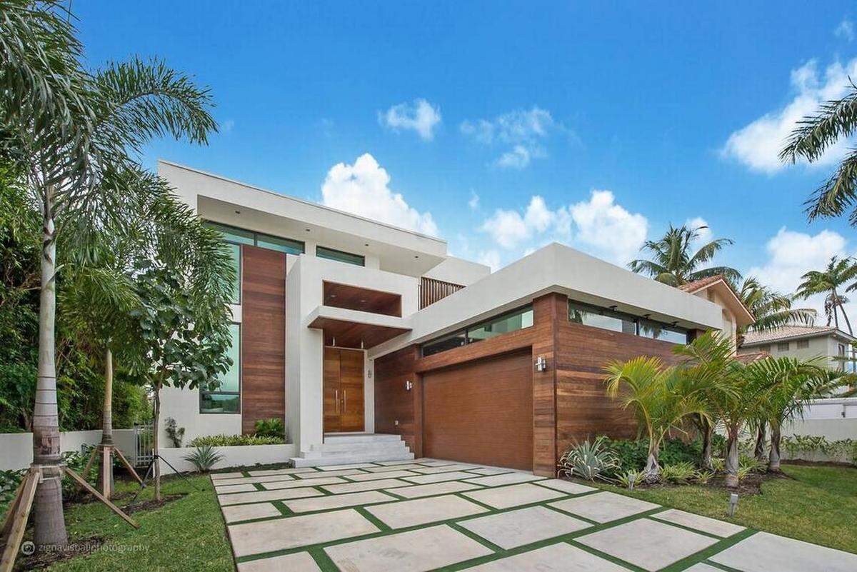 Exterior view of the modern home located in an exclusive gated community of Miami Beach.