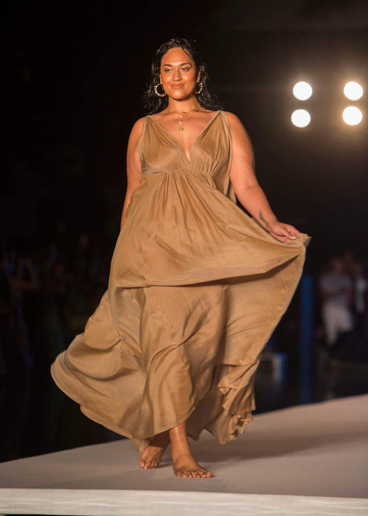 A model walks the runway for the 2018 Sports Illustrated Swimsuit show at PARAISO during Miami Swim Week at The W Hotel South Beach in Miami Beach, FL, on July 15, 2018.