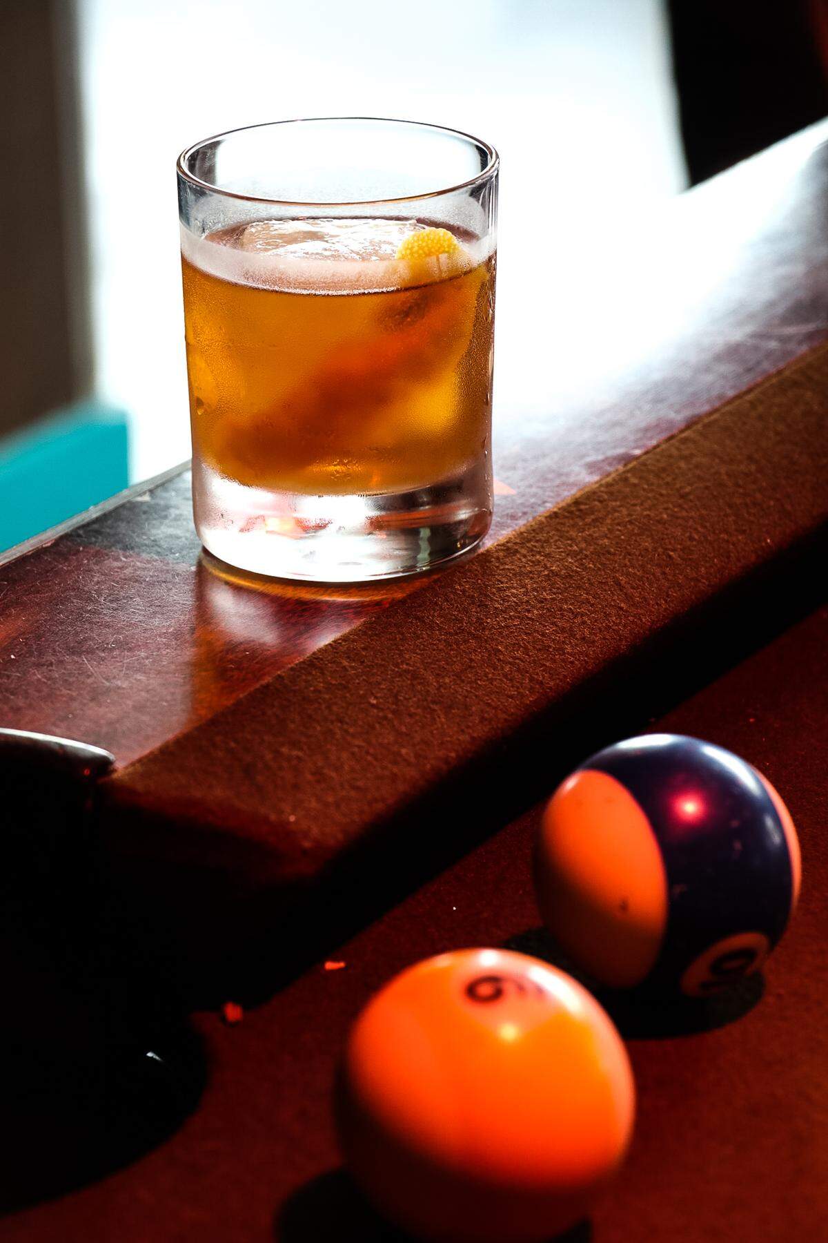 Woodford Bourbon, plum bitters, angostura bitters, simple syrup  served over a coconut ice cube