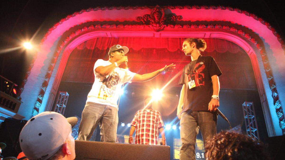 Event runner up DNA battles against event winner MicStew as Bun B looks on in the final round of Red Bull EmSee in Philadelphia.