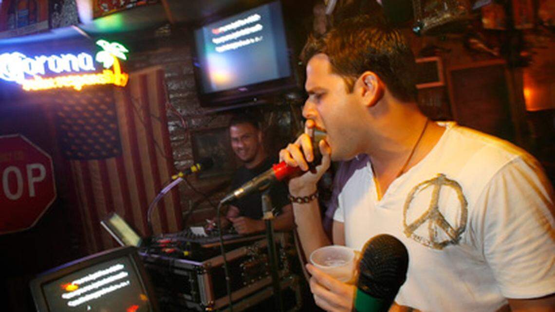 Alfredo "Freddy" Bizzio sings during karaoke night Thursday at Seven Seas in Miami. Photo: Alex Kolyer.