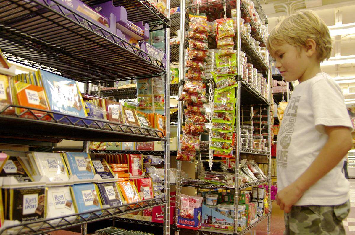 The changing times in Sunny Isles Beach is reflected by Liam Dunagan, 6, who searches for his favorite treat at the Epicure Market in Sunny Isles Beach. CHRIS CUTRO / FOR THE MIAMI HERALD.