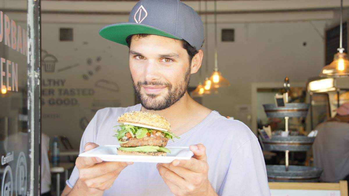 One of the bestselling items at Urban Green is a special veggie burger on bread made from coconut flour, with  veggie mozzarella, avocado, mango salsa and arugula.