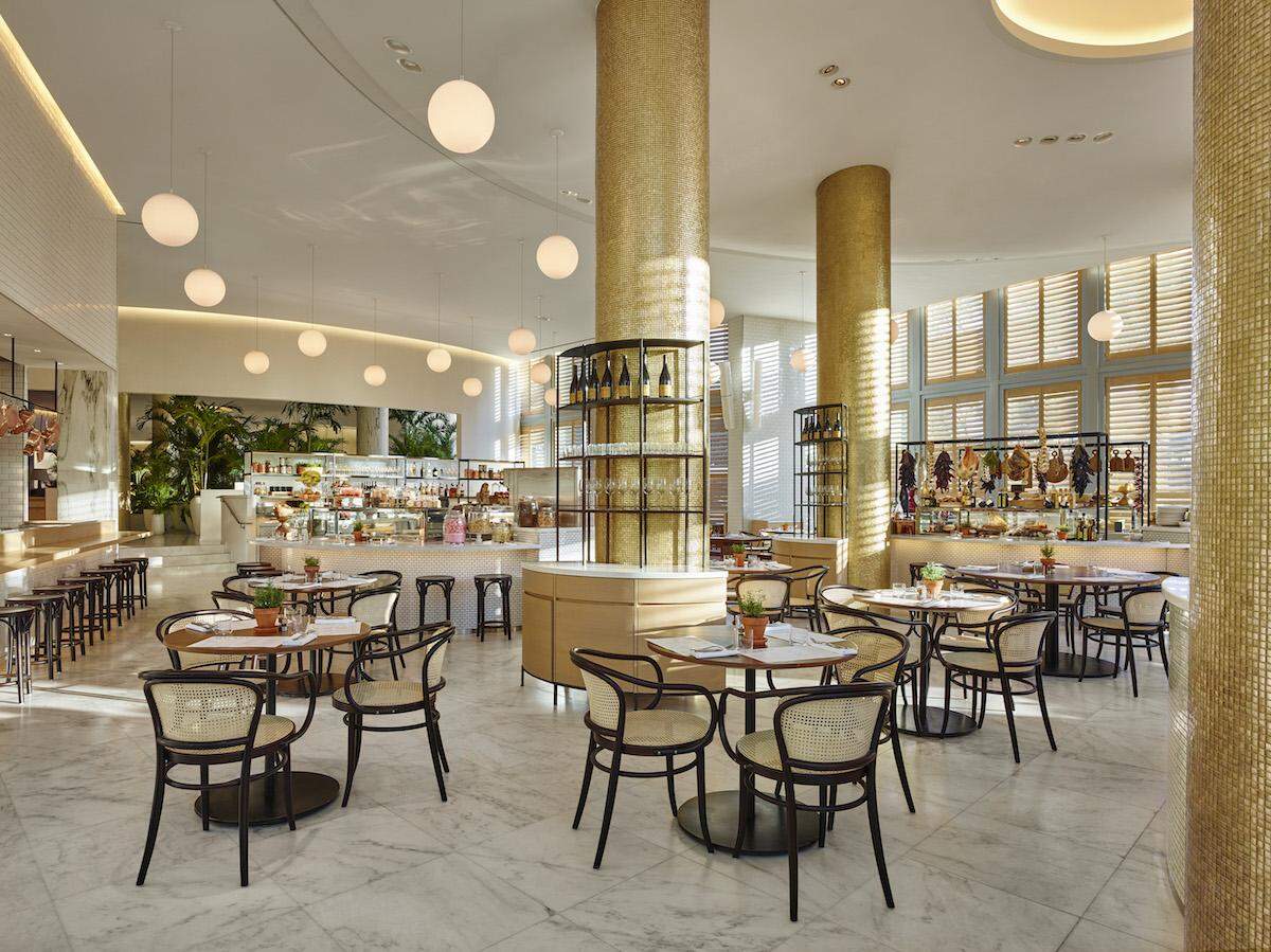 Dine amidst gold mosaic and marble columns at Jean-George's casual restaurant at The Miami Beach EDITION.