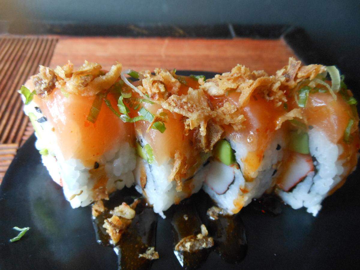Salmon-topped sushi at Sushi Lucy