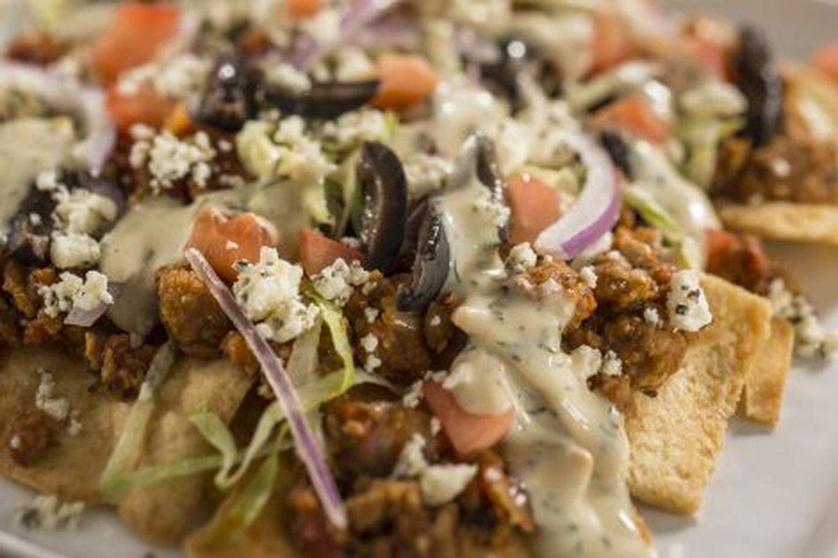 Guests can sample tapas-sized tastes of inventive cuisine such as the Vegan Greek Nachos at the Greece Marketplace during the Epcot International Food &amp; Wine Festival at Walt Disney World Resort in Lake Buena Vista, Fla. The popular fall festival also features wine tastings, culinary demonstrations, mixology seminars, nightly "Eat to the Beat" concerts and a broad range of premium dining events.