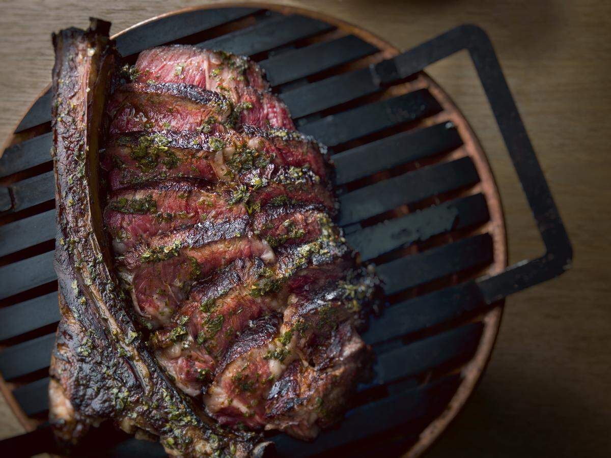 Hanging Tomahawk Steak at Los Fuegos. (Photo by Juan Fernando Ayora)
