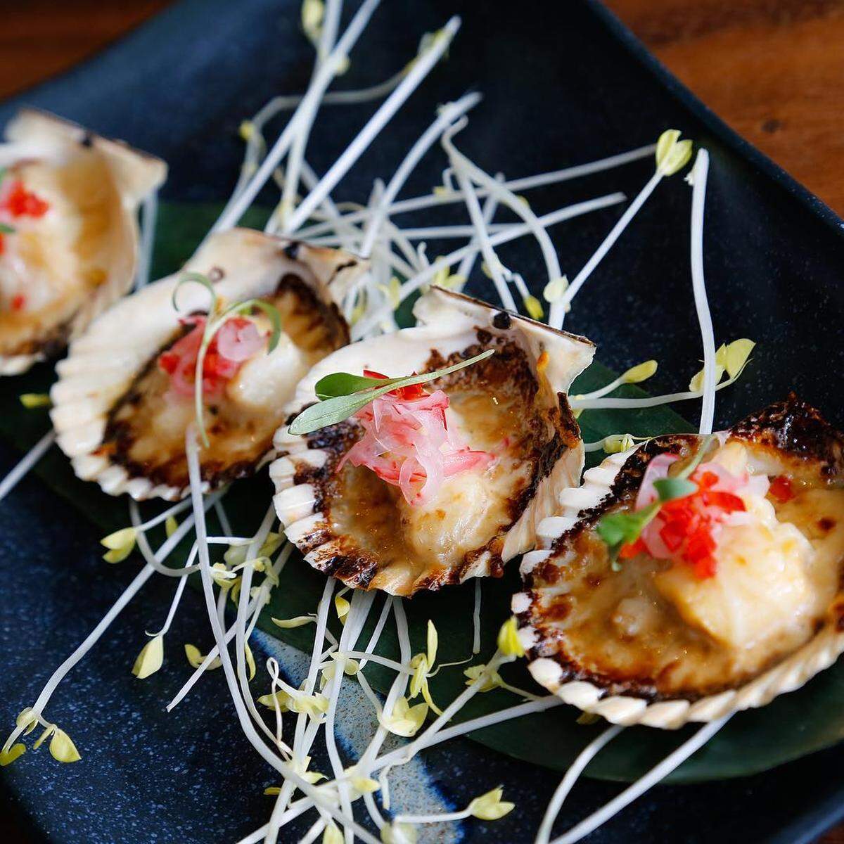 Hotate Parmesan: Scallops served on the shell and brûléed with a touch of cream and Peruvian pisco.