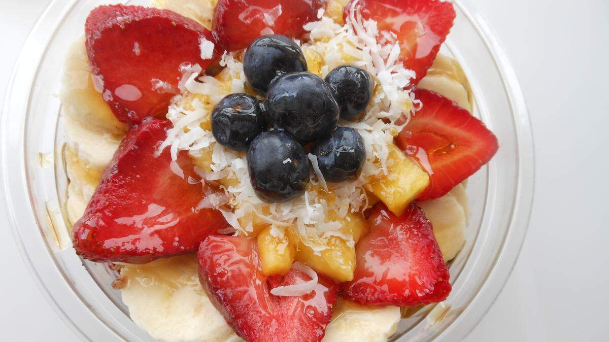 Acai bowl with granola, bananas, berries and shredded coconut at Carrot Express
