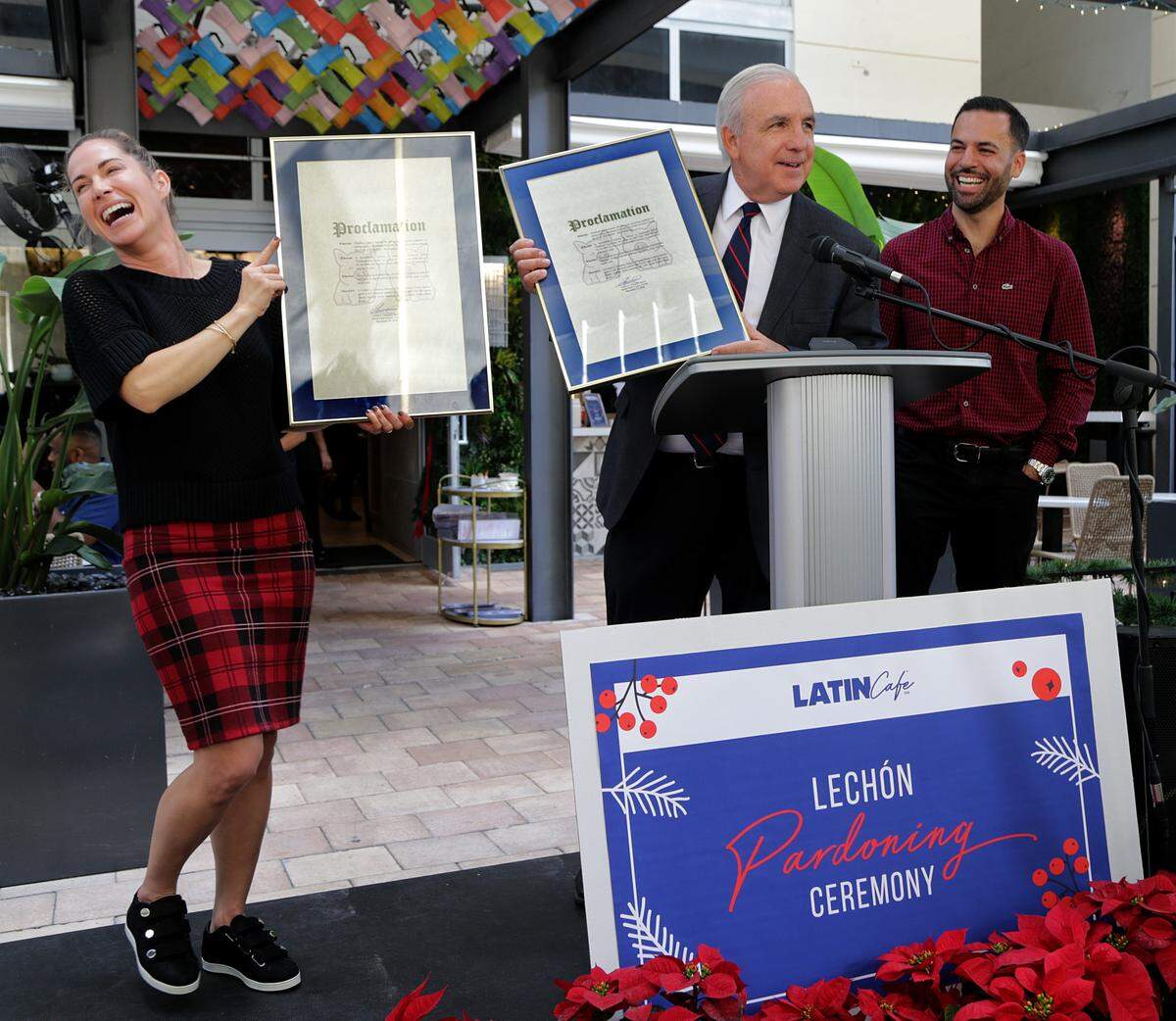Latin Cafe owners Katherine and Eric Castellanos joined Miami Dade County Mayor Carlos Gimenez as they received the County proclamations for pigs Luna and Layla, during the first-ever "Pig-Lechon Pardoning Ceremony" celebrated at Latin Cafe 2000 Brickell in Miami on Wednesday, December 19th, 2018.