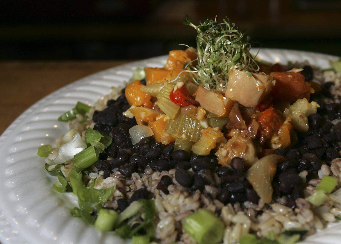 12.19.08 - PHOTO BY CHARLOTTE SOUTHERN - Green Gables Cafe in Coral Gables. Pictured is an Organic Hot Meal daily special: Black beans over basmati brown rice &amp; roasted organic vegetable salad with “mojo” on the side. (2 of 3)