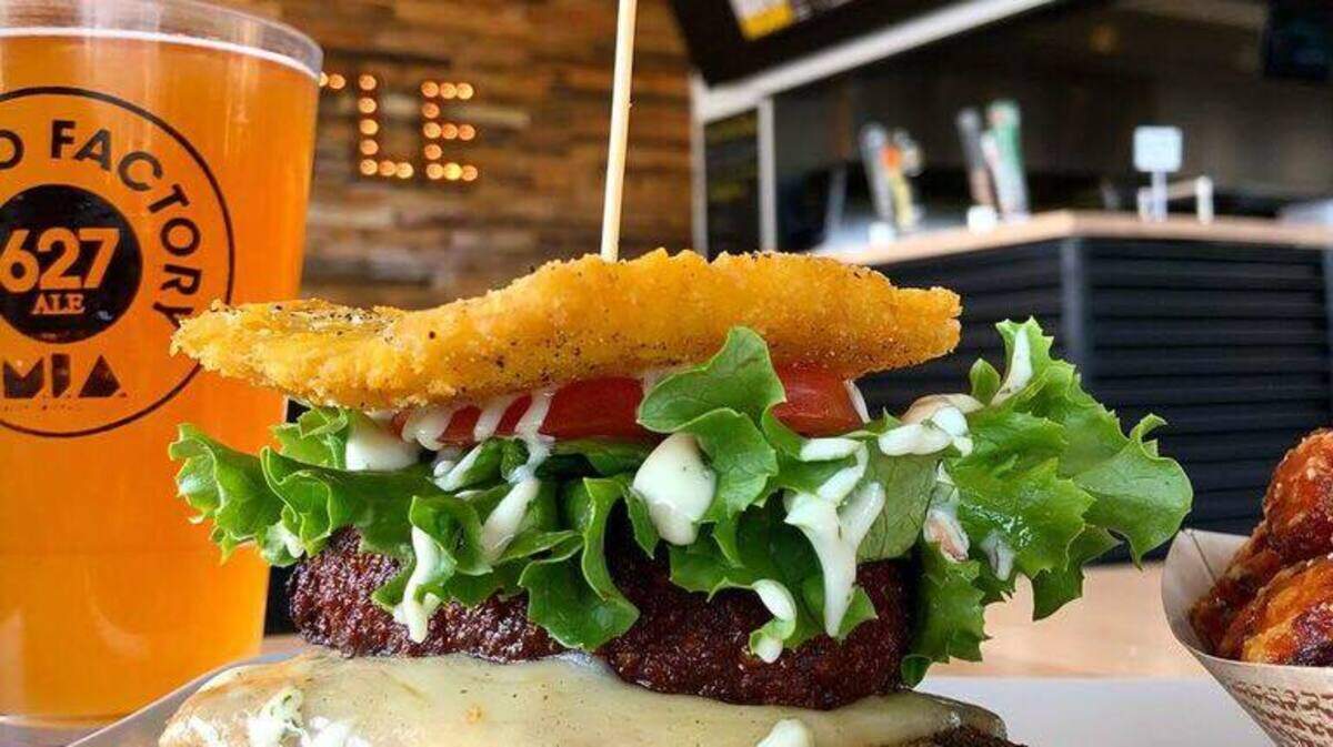 The humungeous sandwich of shredded beef and cheese between large flattened and twice fried plantain slabs, a specialy of Venezuela found at Caballo Viejo Restaurant.