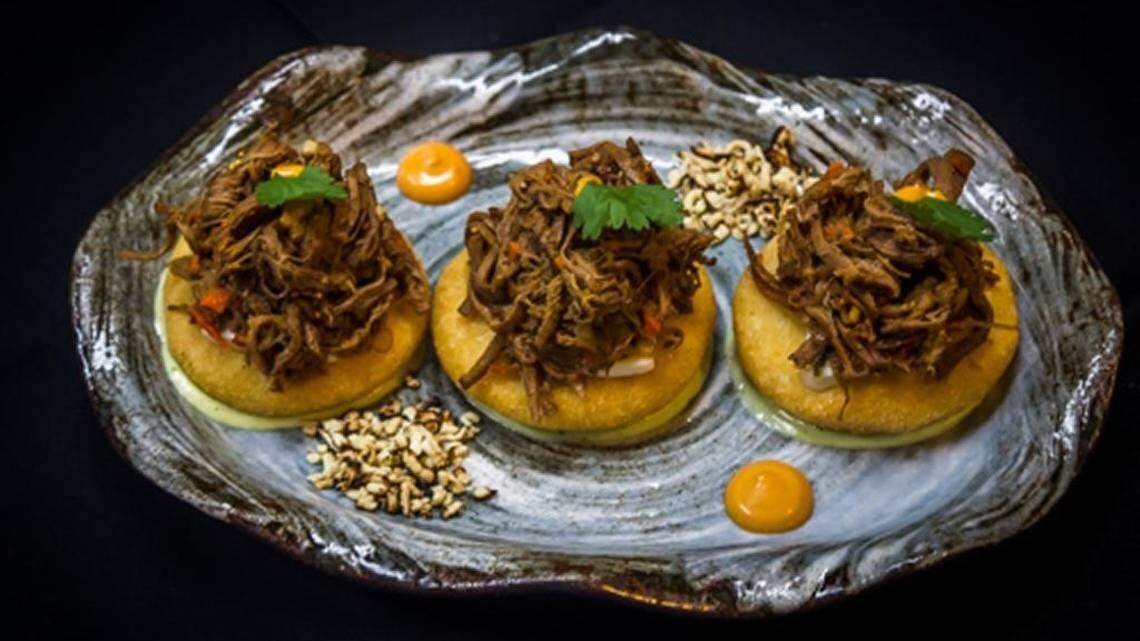 Cardon y El Tiraon’s trio of “arepitas,” bite-sized arepas that are made to order, flash fried to crisp the outside while keeping the inside pillowy perfect. These are topped with ropa vieja shredded beef.
