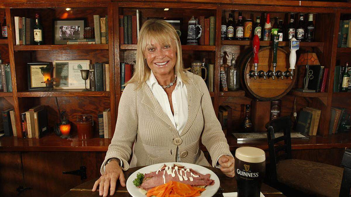 Here is one of the owners Hilary Joyalle with corned beef and cabbage and a pint of Guiness beer. Photo: Joe Rimkus Jr.