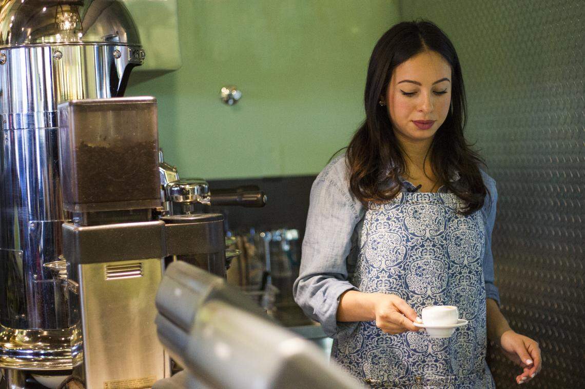 Gabriela Carbone, 20, a barista at Amelia's 1931, prepares a cortadito.