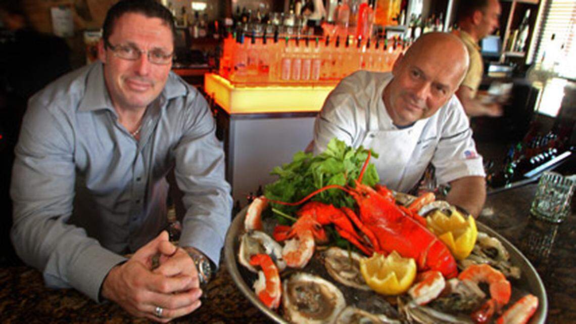 General manager and partner, Pierre Berube and chef and owner Laurent Tasic with the "Shellfish Tower" in their restaraunt, Sage, in Hollywood on June 12th, 2009.Photo: Joe Rimkus Jr.