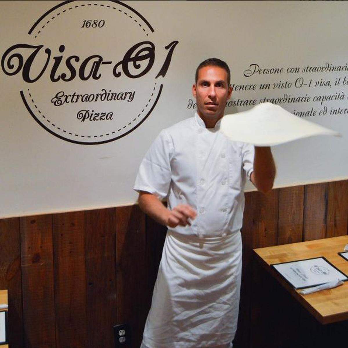 Pizza master Ranato Viola spins pies at Mister 01's original location in South Beach. (Handout)