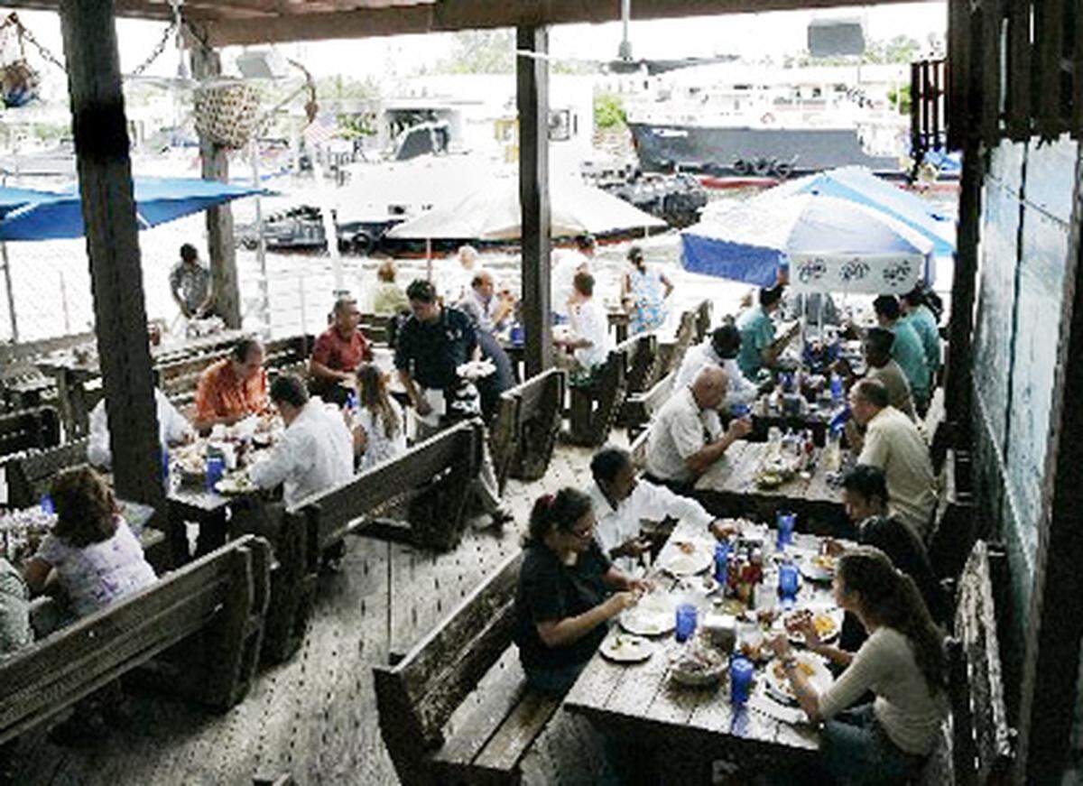 Watch the freighters slide through the Miami River at Garcia’s.