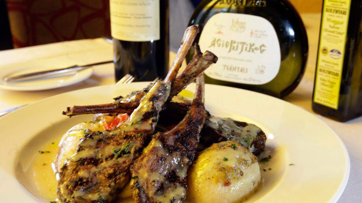 Lamb chops, lemon potatoes and vegetables.