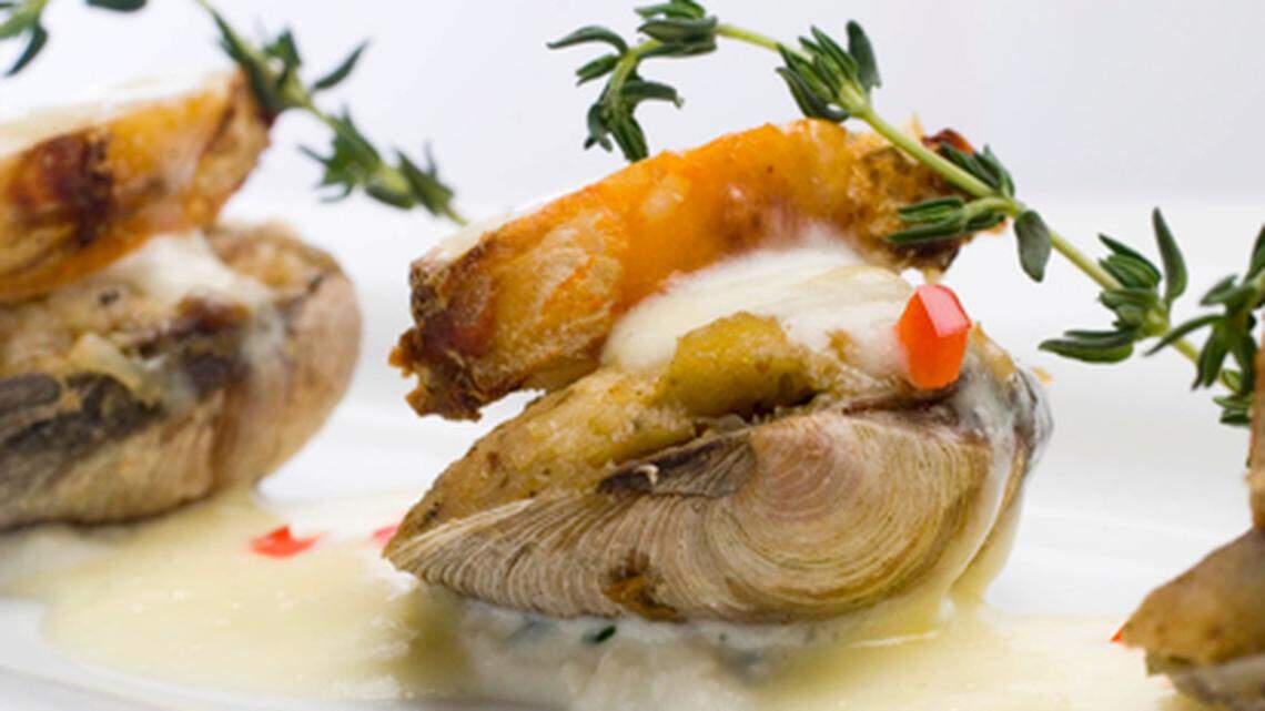 Vongole Oreganata – Steamed middle neck clams on the half shell, topped with sweet lobster meat, scampi butter, breadcrumbs and thyme.