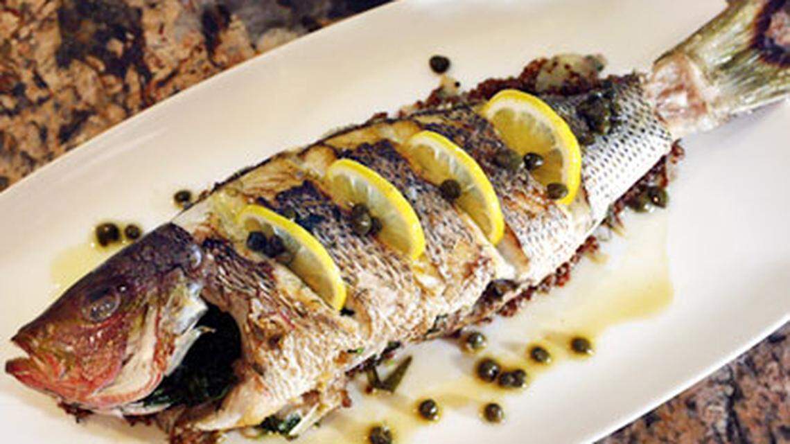 Whole yellowtail snapper with red quinoa, capers and saffron tea(cq) is one of the offerings at Chef Allen's, 19088 NE 29th Ave., Aventura. Chef and owner Allen Susser has a new menu and a new look for his restaurant. Photo: Marsha Halper.
