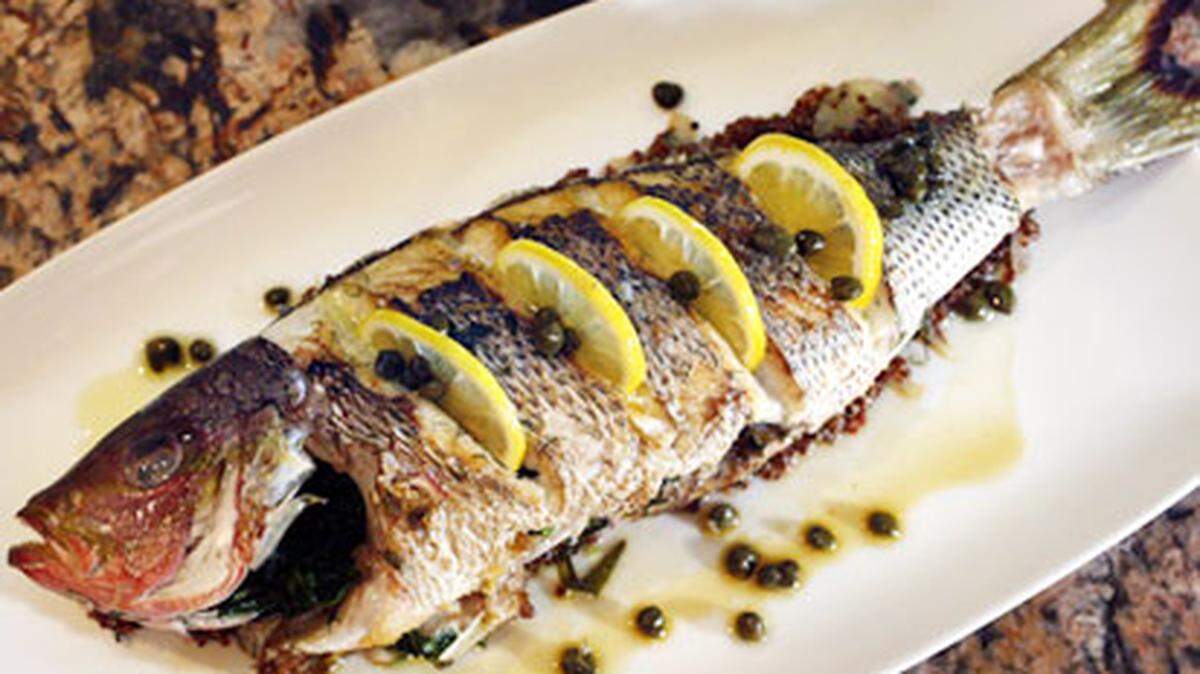 Whole yellowtail snapper with red quinoa, capers and saffron tea(cq) is one of the offerings at Chef Allen's, 19088 NE 29th Ave., Aventura. Chef and owner Allen Susser has a new menu and a new look for his restaurant. Photo: Marsha Halper.
