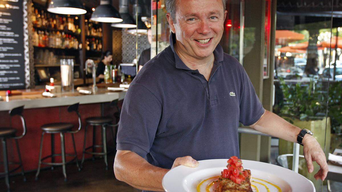 Owner Sylvano Bignon presents Lulu's salmon plate.