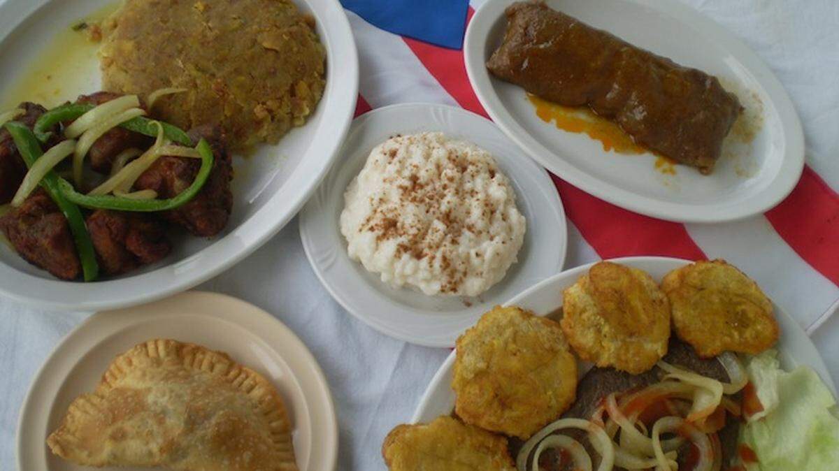 Mofongo with fried porkmchunks, pasteles, bistek with  tostones and a shrimp empanada at El Bajareque in Wynwood.
