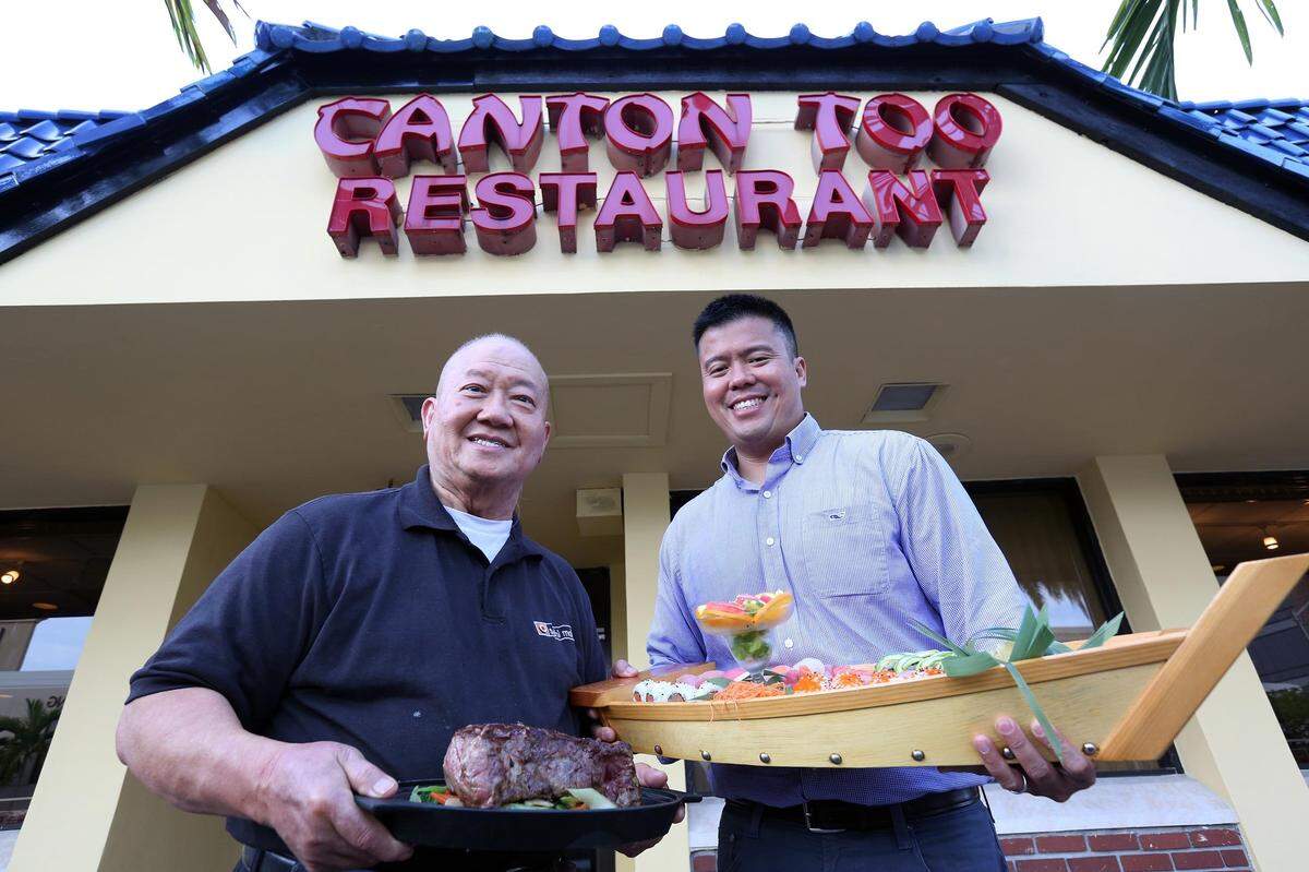 Abe Ng (right) and his father Allan Ng (left) at the Canton Restaurant in Coral Gables on Saturday, May 27, 2017, for a story about the Ng family, which owns Canton and Sushi Maki restaurants in Miami.