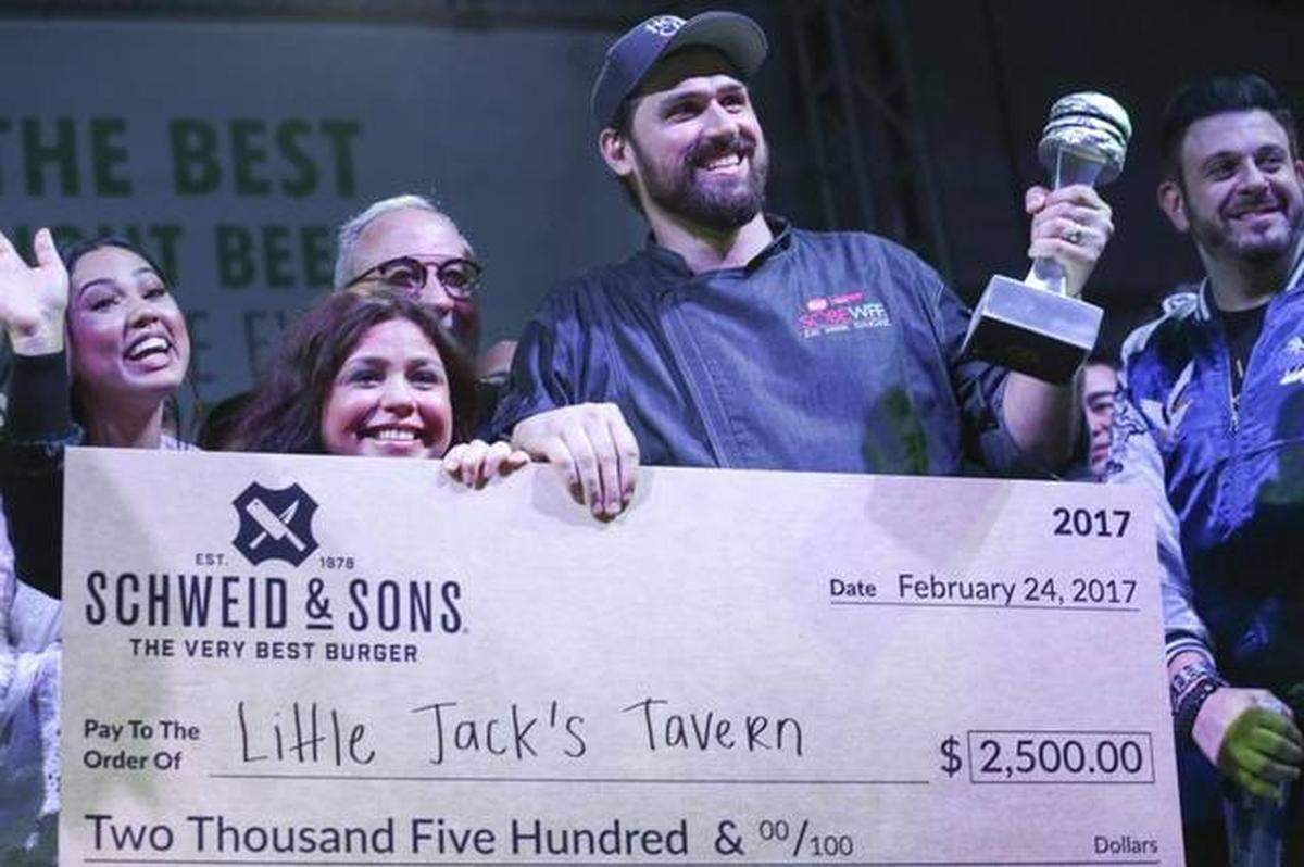 Rachel Ray, center left, awards the $2,500 Schweid &amp; Sons The Very Best Burger Award to Little Jack's Tavern during the Burger Bash at the 2017 South Beach Wine &amp; Food Festival on Friday, Feb. 25, 2017.