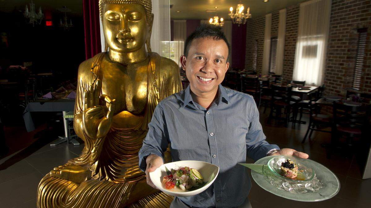 FORT LAUDERDALE: Edi Mulyanto, owner of Dapur Lounge, presents a plate of ceviche and his catch of the daywith hamachi tartar.
