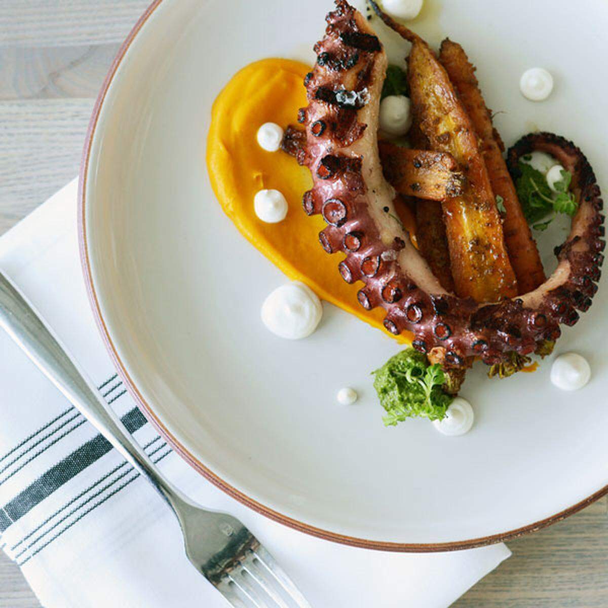 Chef Paula DaSilva has reemerged with Artisan Beach House, preparing dishes such as this octopus with vadouvan carrots.