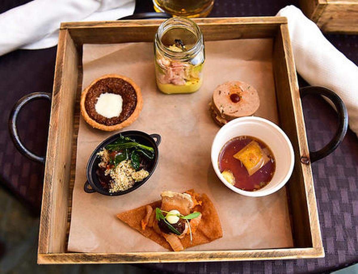 Paula DaSilva's dishes at Cochon 555 Sunday showed off classic French techniques, such as this consumme, and her Brazilian background with her feijoada.