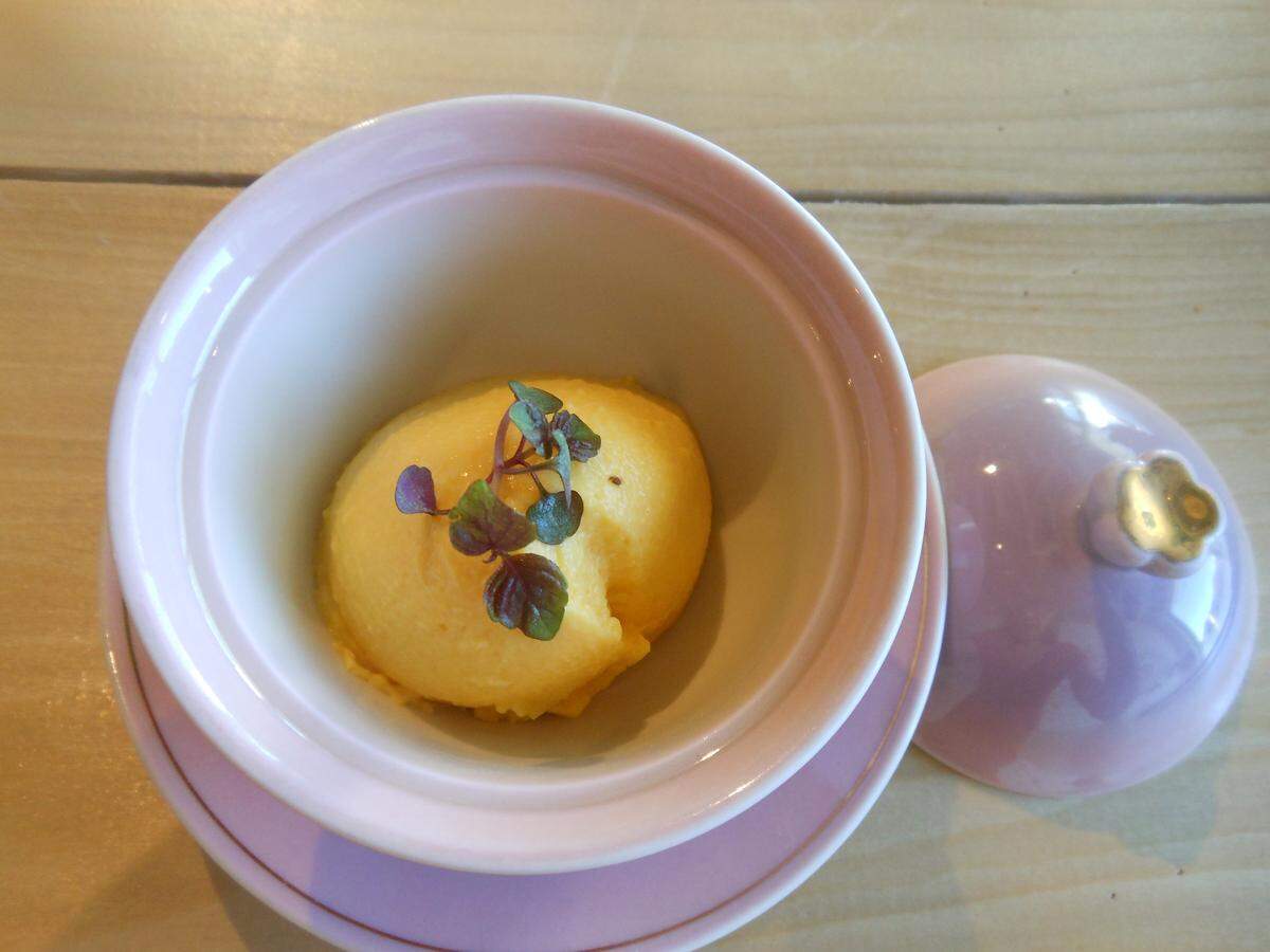 Mango panna cotta with micro greens.