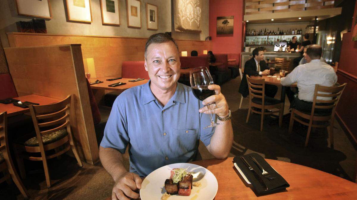 FORT LAUDERDALE: Owner Dave Nicholas with pork belly, watermelon, green apple and peanuts.