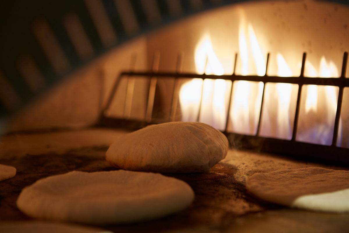 Pita bread is baked in house at Dizengoff.