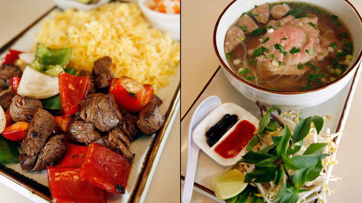 Shaking Beef, Wok tossed marinated filet mignon and sauteed red onion, bell peppers, served with slaw and fried rice, $15.00. Combination Pho, slices of rare steak, brisket and meatball, $9.00.